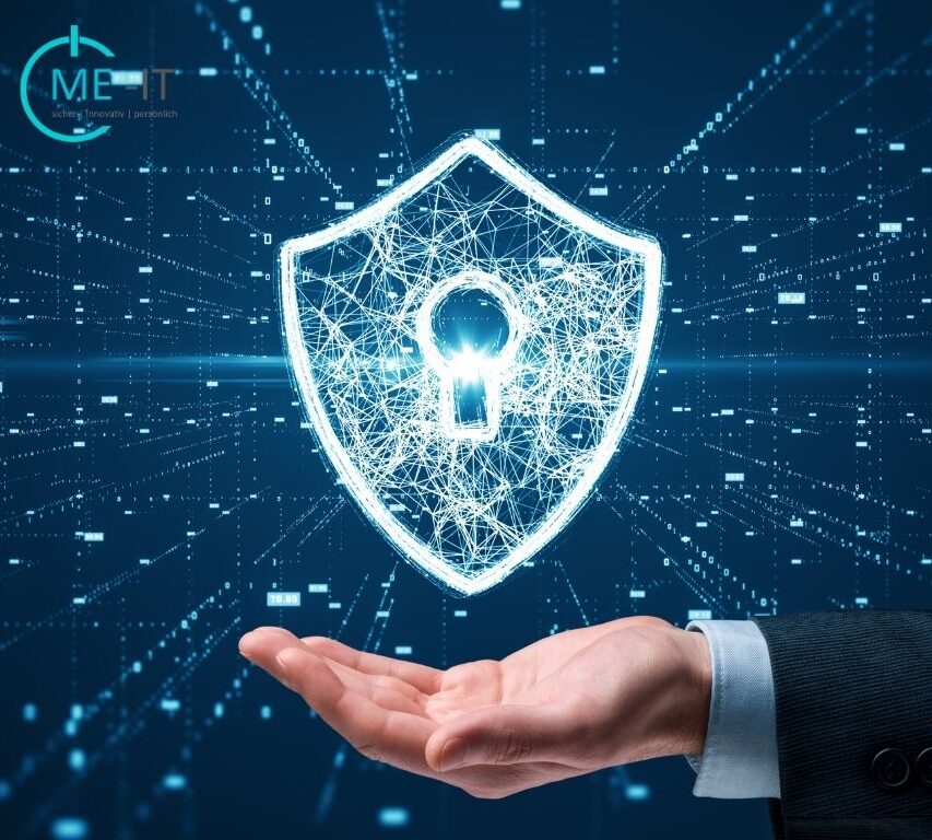 "A business professional's hand supporting a digital shield with a glowing lock icon, symbolizing cybersecurity and data protection in a tech-driven environment."